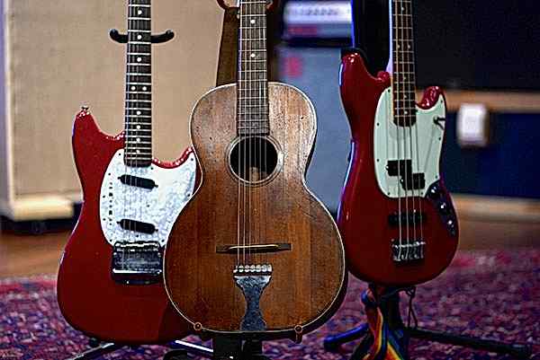 Fender '67 Mustang electric guitar, Vintage Parlour Guitar and a Fender Mustang Bass Guitar at Blue Light Studio.